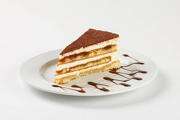 istock Delicious chocolate cream cake on the plate on white background. 524029294
