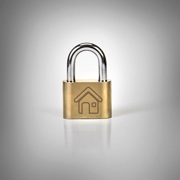 istock Metalic padlock with home icon on grey background 524029306
