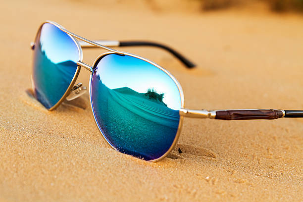 istock Sunglasses on the sand in the desert. 524032770