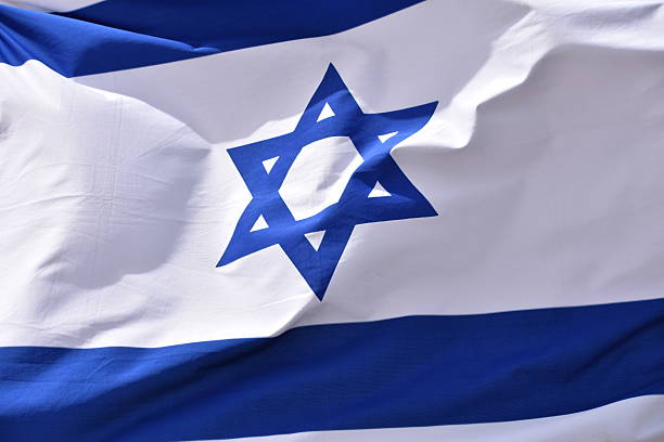 istock Israeli flag in  wind 524033822