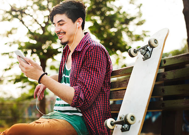 istock Skateboarding Sitting Relaxation Park Holiday Concept 524034126
