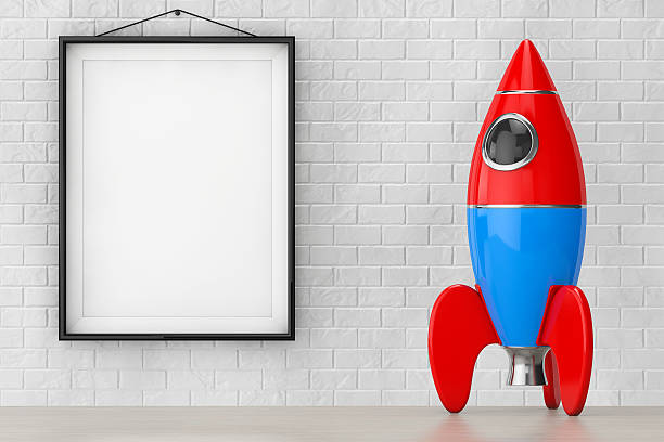 istock Childs Toy Rocket in front of Brick Wall with Frame. 524037140