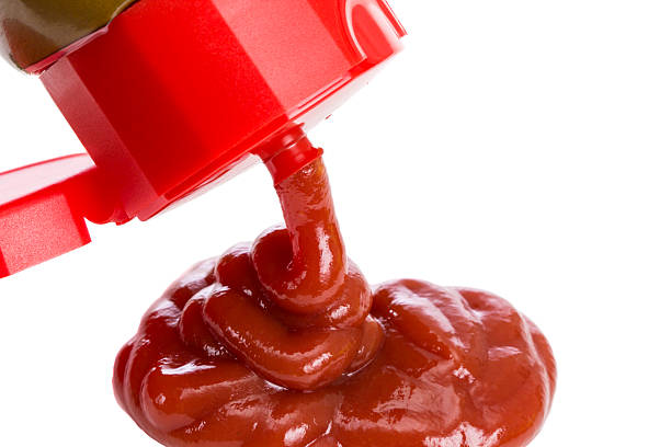 istock Ketchup pouring out of bottle 524048347