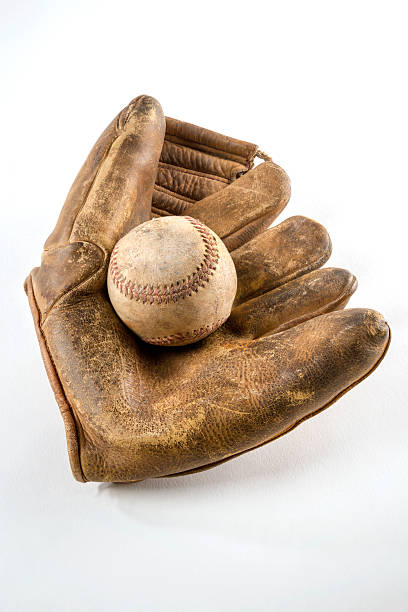 istock Abandoned baseball glove and ball 524051333