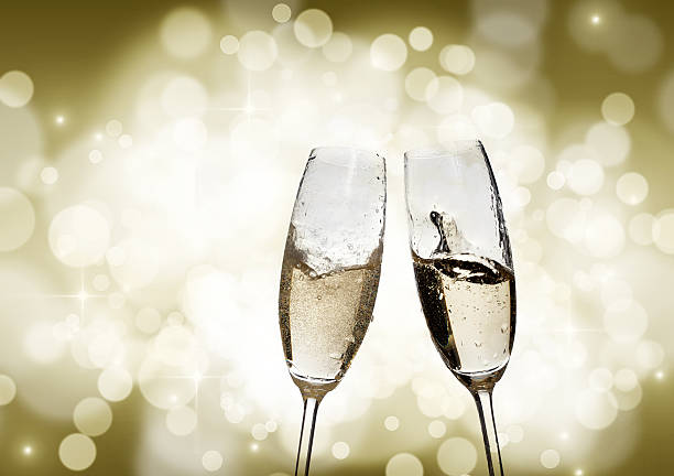 istock Toasting with champagne glasses on sparkling holiday background 524051547