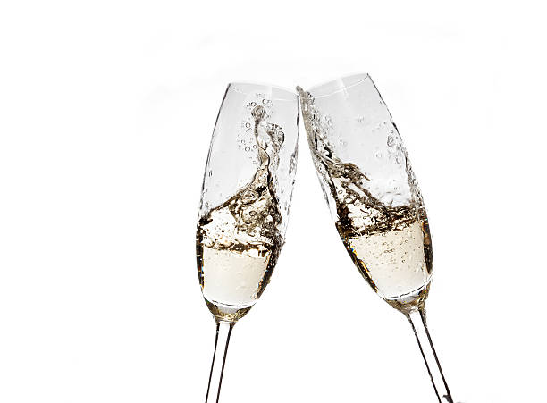 istock Toasting with champagne glasses on white background 524051693