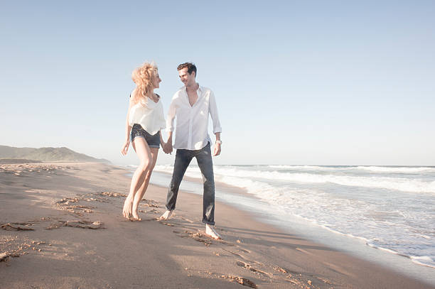 istock Young beautiful couple having fun at the beach 524052603