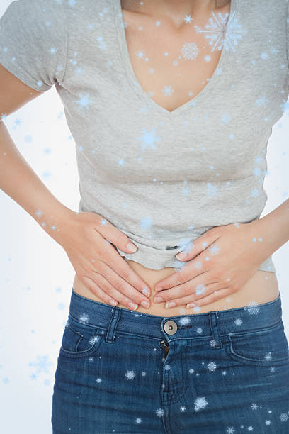 istock Composite image of woman with abdominal pain 524053763