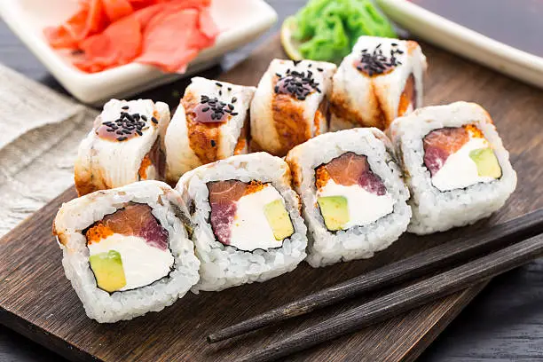 Photo of Sushi roll with salmon, tuna and eel