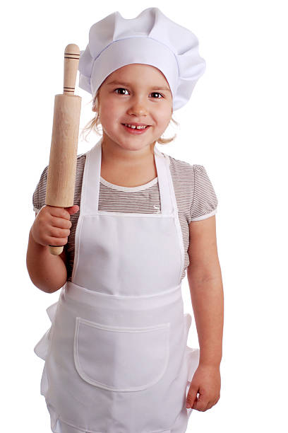 istock Little girl dressed as a cook on an isolated background 524055397