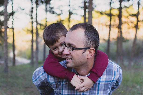 istock Father and son at autumn walk 524055923