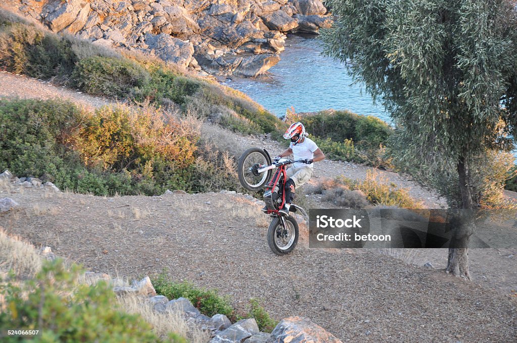 Moto Trial Adventure A 30's turkish Motorbike racer is training on the mountains of Mersin. Acrobatic Activity Stock Photo