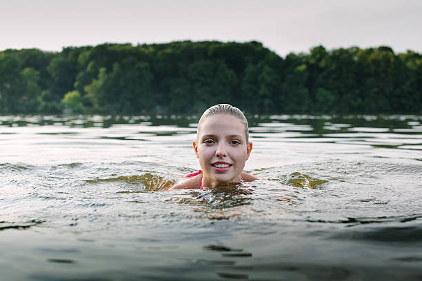 istock Woman wading in a Lake 524067339