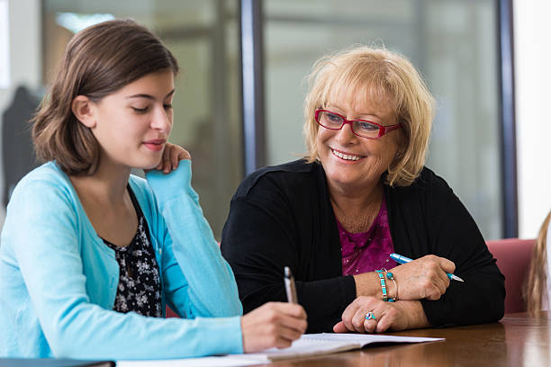 istock Student meeting with school counselor in office 524067603