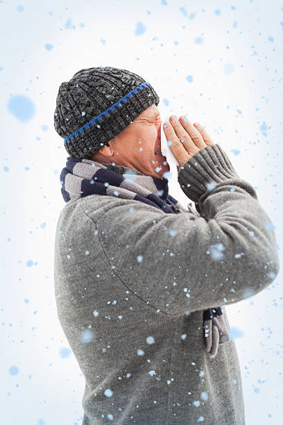 istock Sick mature man blowing his nose 524068849