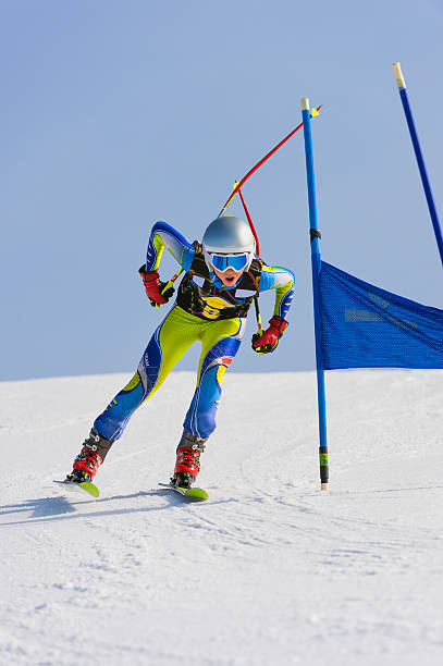 istock Young Male Skier at Straight Downhill Race 524069733