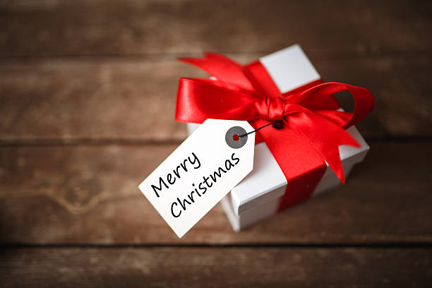 istock Merry Christmas on greeting card gift box 524069755