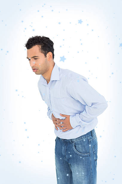 istock Casual young man with stomach pain 524071019
