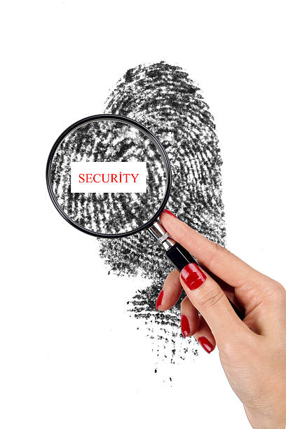 확대경 및 지문 - biometrics touching glass fingerprint 뉴스 사진 이미지