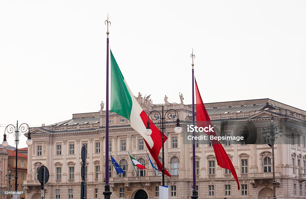 Italian and Trieste flags View of Italian and Trieste flags blowing in the wind Banner - Sign Stock Photo