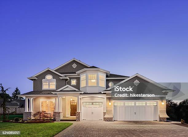 Beautiful Exterior Of New Luxury Home At Twilight Stock Photo - Download Image Now - Residential Building, Home Interior, Building Exterior