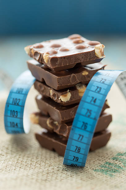 istock Chocolate and Tape Measure - Diet Concept 524087357