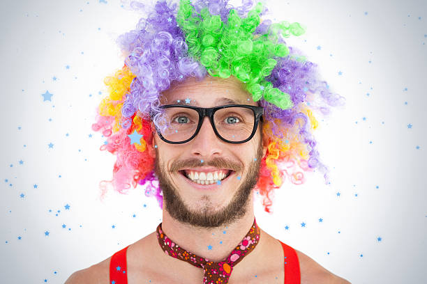 istock Geeky hipster in afro rainbow wig 524087735