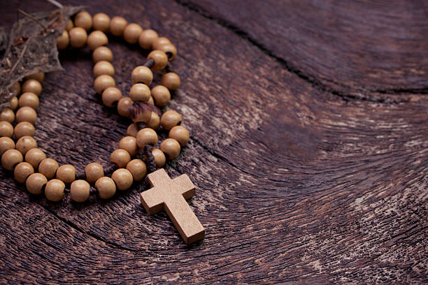 istock Wooden rosary beads on old wooden background 524088601
