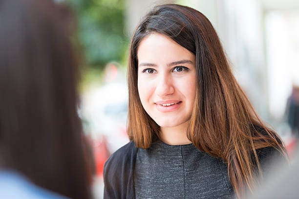 istock Turkish girl talking with her friend at a cafe 524088935