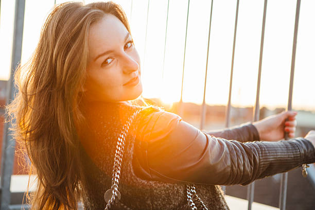 istock modern young woman portrait in urban scene with back lit 524088939