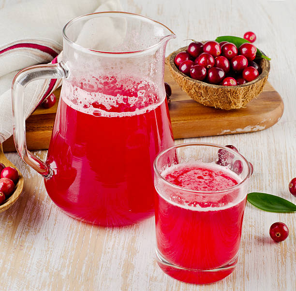 istock Cranberry drink on  wooden background 524090009