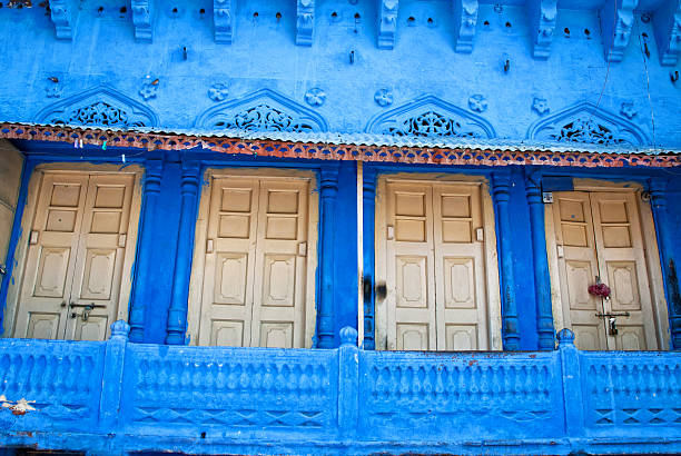 istock Old white wood doors with blue wall. Jodhpur, Rajasthan, Iindia; 524090397