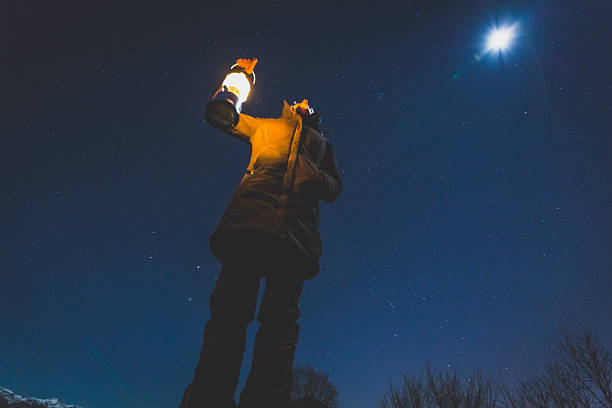 istock Woman looks comet in the night sky 524090399
