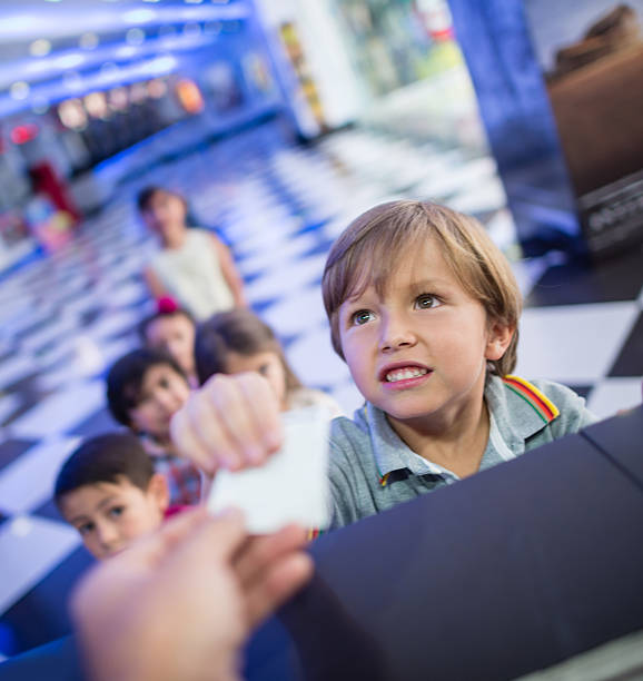 istock Boy buying a movies ticket 524090835