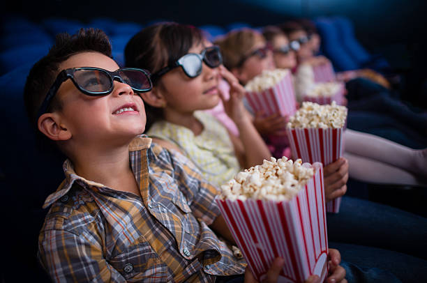 istock Kids at the movie theatre 524090843