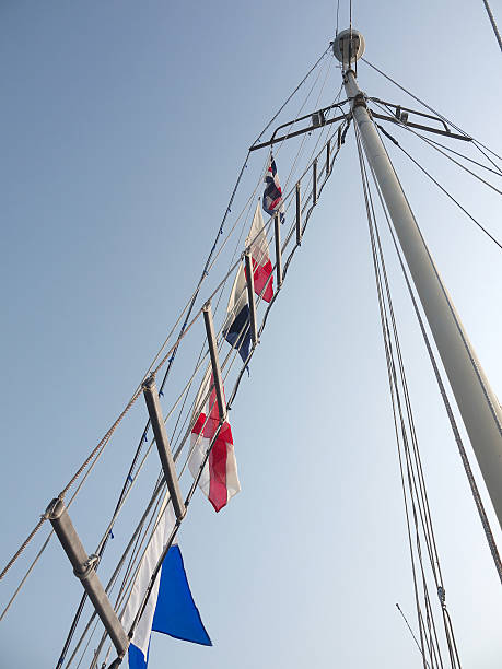 istock Holiday flags on sailing ship mast waving on the wind 524091223