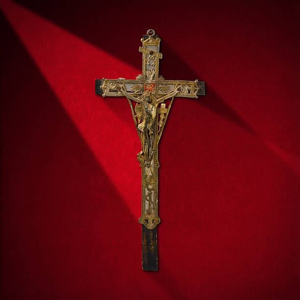 istock Old Cross With Jesus on Red Velvet 524092003