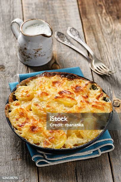 Potato Gratin In Casserole With Cream And Cheese Stock Photo - Download Image Now - Gratin, Prepared Potato, Baked