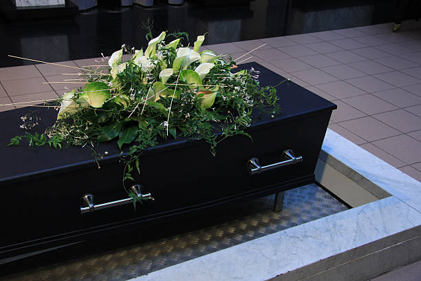 Funeral flowers on a casket stock photo