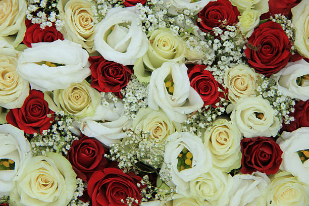 Red and white roses in a floral wedding centerpiece