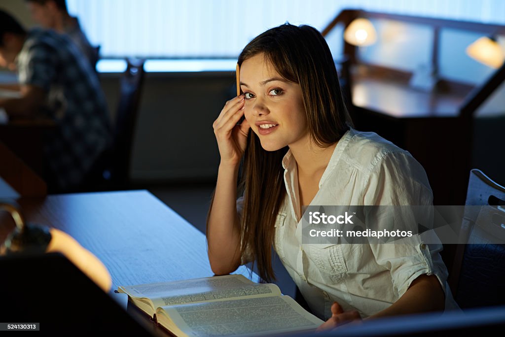 beautiful female student beautiful female student sitting in library 16-17 Years Stock Photo