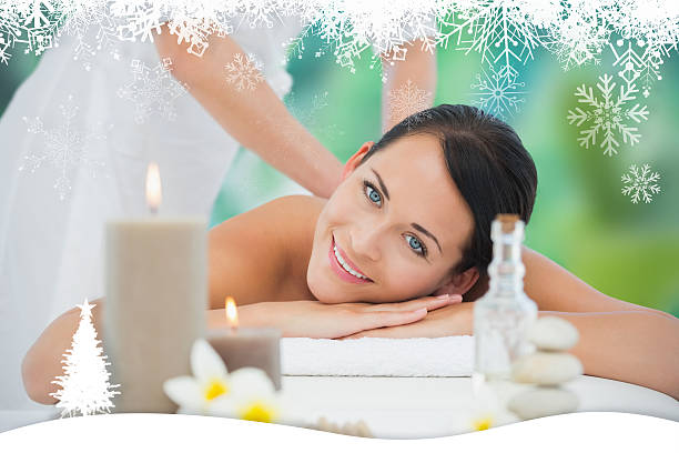 istock Beautiful brunette enjoying a back massage smiling at camera 524133069