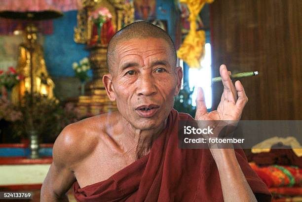 Monk Smoking At The Monastery Of The Village Of Joate Stock Photo - Download Image Now