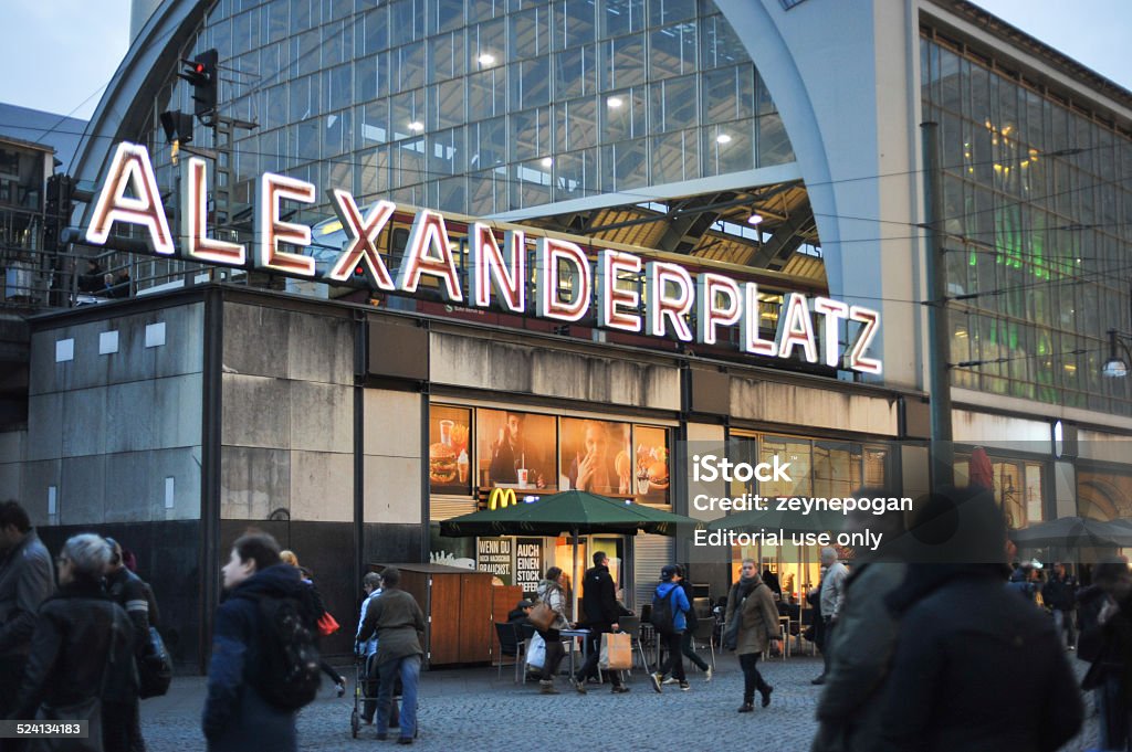 People walking in front of Alexanderplatz Station Berlin, Germany - November 15, 2014: People walking in front of Alexanderplatz Station in afternoon Alexanderplatz Stock Photo