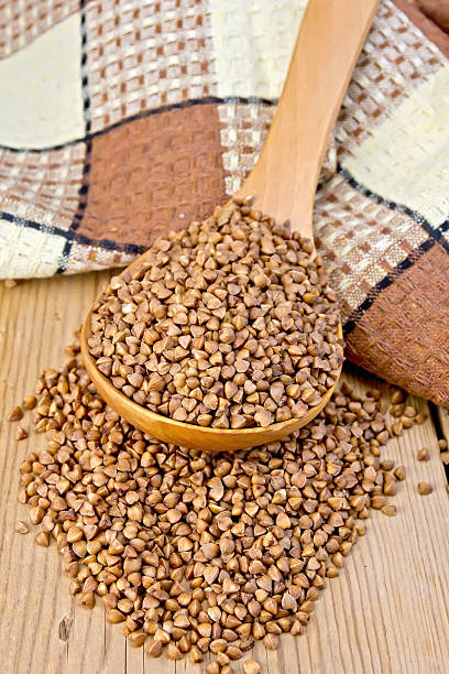 istock Buckwheat in spoon on board with napkin 524134419