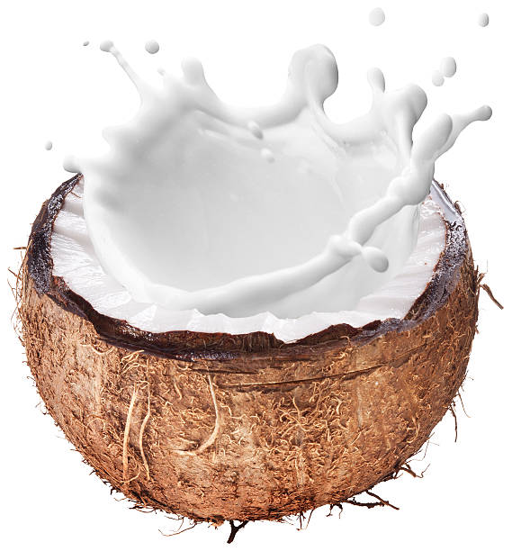 Coconut with milk splash inside. Coconut with milk splash inside. File contains clipping paths. coconut milk stock pictures, royalty-free photos & images