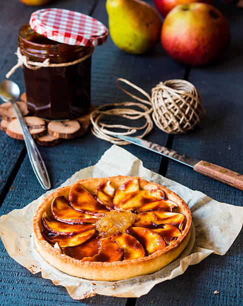 istock round apple tart with pear jam and caramel, vertically 524149617