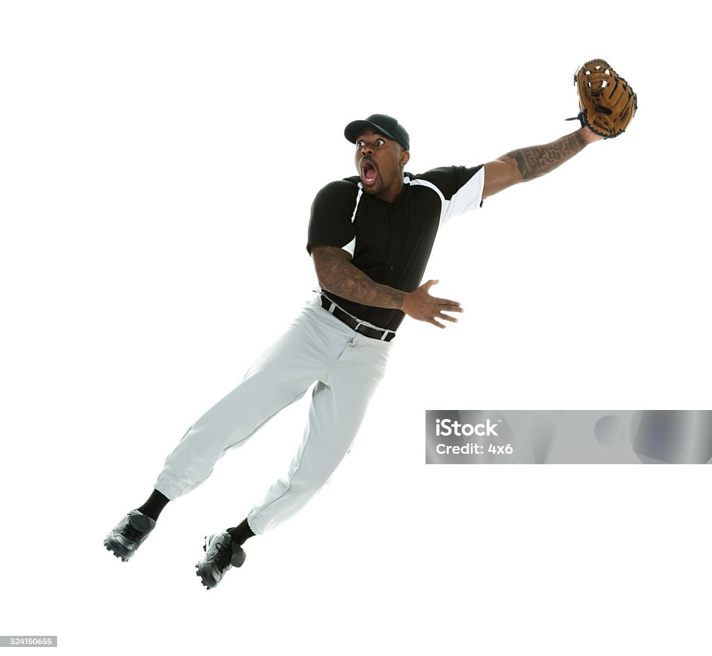 Shocked baseball player jumping & catching the ball Shocked baseball player jumping & catching the ballhttp://www.twodozendesign.info/i/1.png Baseball - Ball Stock Photo