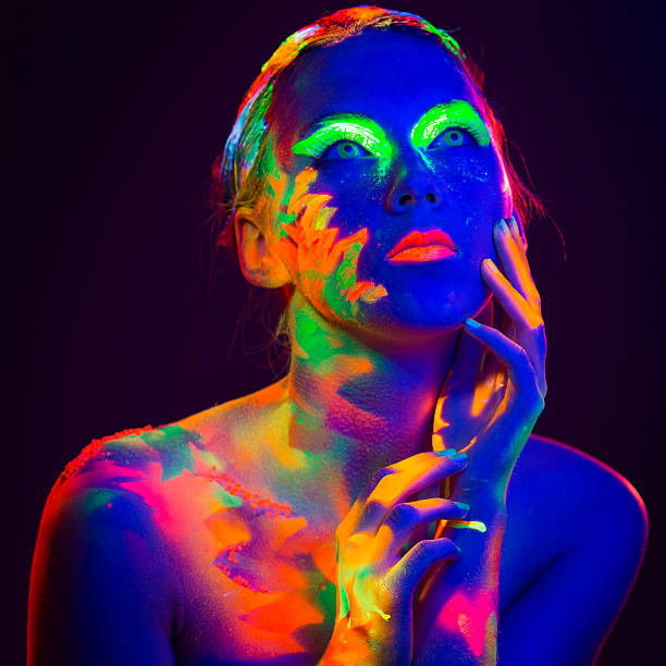 istock Woman Portrait painted with UV makeup color 524150665