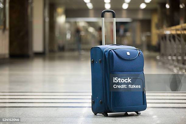 Blue Suitcase At Airport Stock Photo - Download Image Now - Suitcase, Airport, Travel